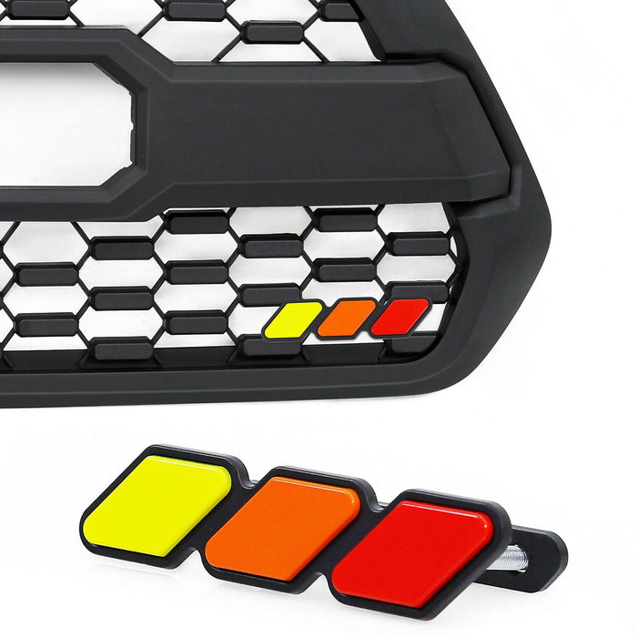 Red, orange and yellow retro grille badge on a TRD Pro style mesh grille