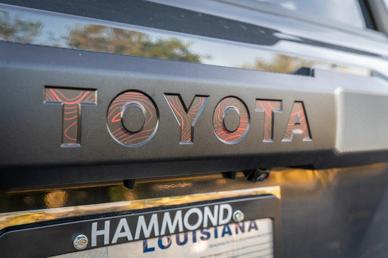 Load image into Gallery viewer, TOYOTA Topographic Rear Liftgate Emblem Inlays - 2025+ 4Runner

