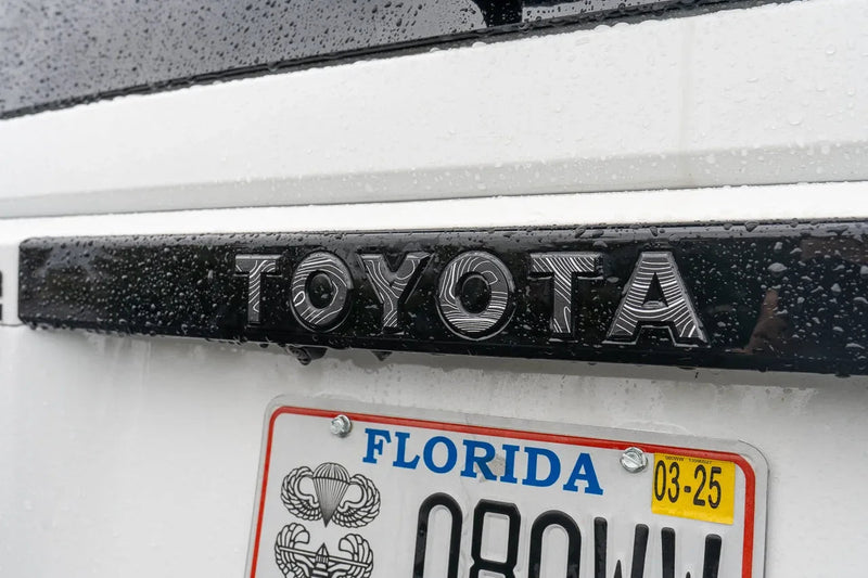 Load image into Gallery viewer, &quot;TOYOTA&quot; Topo Rear Tailgate Emblem Overlays - 2024+ Land Cruiser
