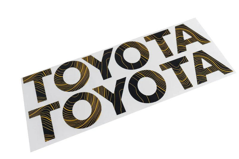 Load image into Gallery viewer, &quot;TOYOTA&quot; Topo Front Grille Emblem Kit - 2024+ Land Cruiser  / 07-14 FJ Cruiser
