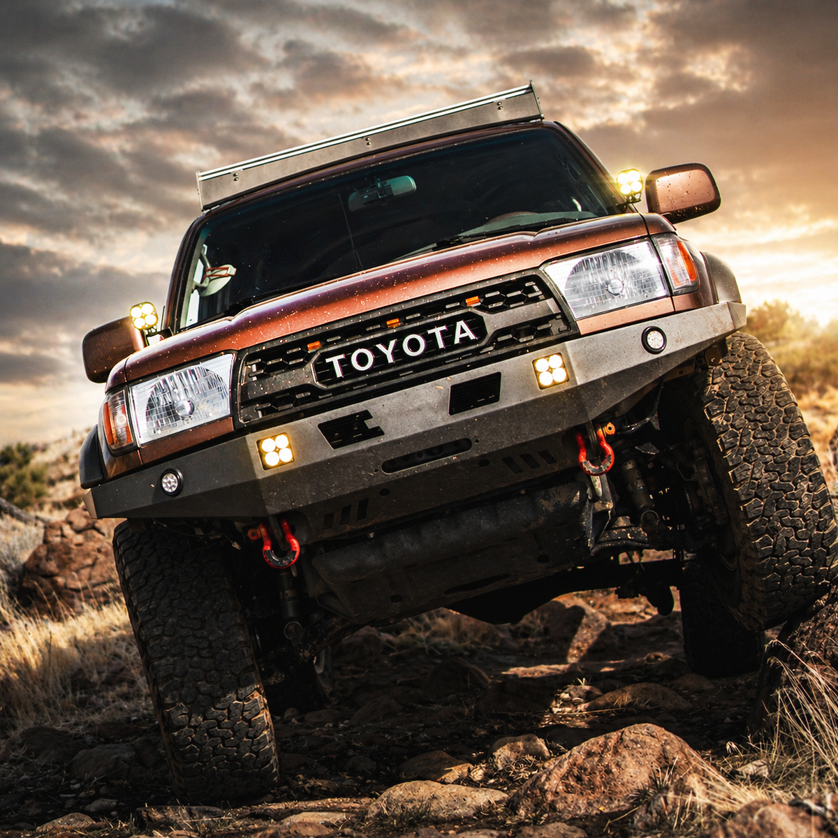 3rd Gen 4Runner with TRD style grille and TOYOTA letters on a rocky trail